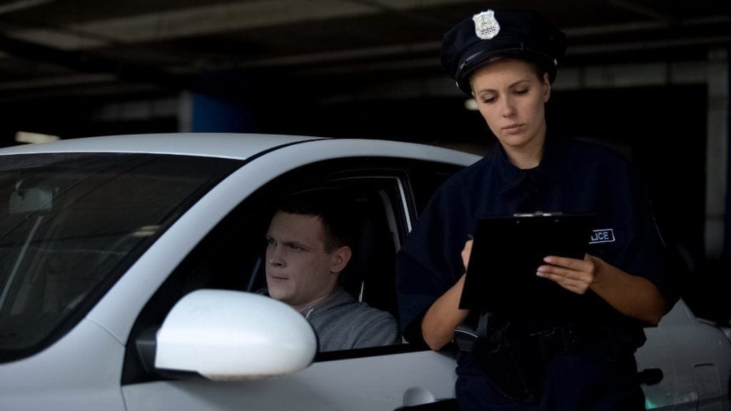 police giving driver a ticket