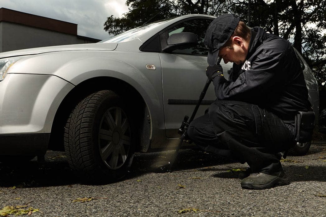 Police officer searching a vehicle